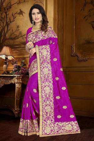 For A Rich And Elegant Look, Grab This Designer Saree In Magenta Pink Color Paired With Magenta Pink Colored Blouse. This Saree And Blouse Are Silk Based Beautified With Resham Embroidery And Lace Border. Buy This Rich Looking Saree Now.