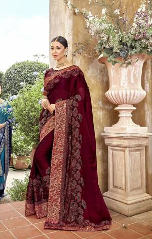 For A Royal Look, Grab This Heavy Designer Saree In Maroon Color Paired With Maroon Colored Blouse. This Saree Is Fabricated On Georgette Paired With Art Silk Fabricated Blouse. This Saree Is Easy To Drape And Carry All Day Long. 