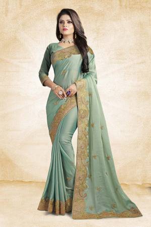 Get Ready For The Upcoming Festive And Wedding Season Wearing This Designer Saree In Pastel Green Color Paired With Pastel Green Colored Blouse. This Saree And Blouse Silk Based Beautified With Elegant Embroidered Lace Border. 