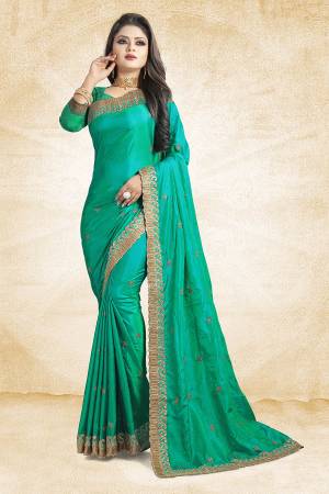 Shine Bright Wearing This Designer Saree In Sea Green Color Paired With Sea Green Colored Blouse. This Saree Is Fabricated On Paper Art Silk Paired With Art Silk Fabricated Blouse. It Is Beautified With Embroidered Lace Border And Butti All Over. 