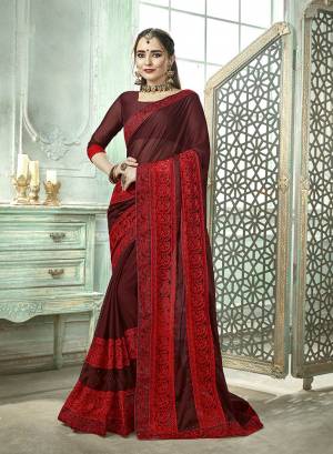 Here Is A Very Pretty And Light Weight Saree In Maroon Color Paired With Maroon Colored Blouse. This Saree And Blouse Are Fabricated On Silk Georgette Beautified With Thread Embroidery And Moti Work. Buy This Designer Saree Now.