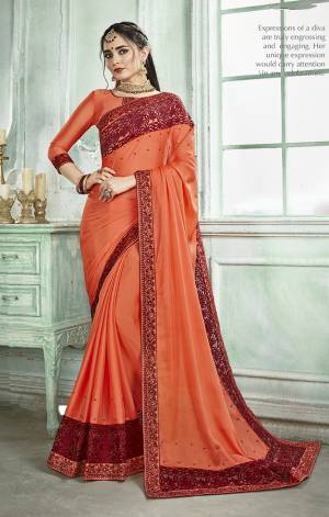 Here Is A Very Pretty And Light Weight Saree In Orange Color Paired With Orange Colored Blouse. This Saree And Blouse Are Fabricated On Silk Georgette Beautified With Thread Embroidery And Moti Work. Buy This Designer Saree Now.