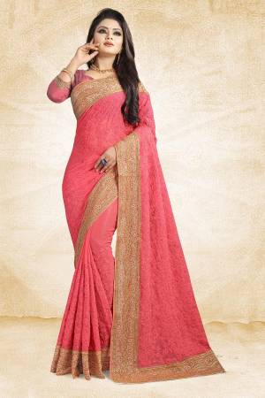 Get Ready For The Upcoming Wedding Season With This Heavy Designer Saree In Dark Peach Color Paired With Dark Peach Colored Blouse. This Saree Is Fabricated On Chiffon Beautified With Heavy Embroidery And Heavy Embroidered Lace Border Paired With Art Silk Fabricated Blouse. 