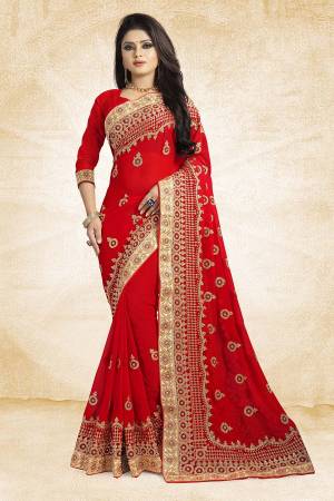 Celebrate This Festive Season With Beauty And Comfort Wearing This Heavy Designer Saree In Red Color Paired With Red Colored Blouse. This Saree Is Georgette Based With Heavy Embroidery Paired With Art Silk Fabricated Blouse. Buy Now.