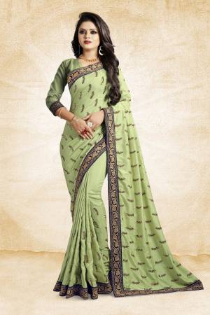 For Rich, Heavy And Elegant Look, This Saree Is Suitable For All. Grab This Designer Saree In Light Green Color Paired With Light Green Colored Blouse. This Saree And Blouse Are Silk Based Beautified With Embroidered Buttis And Lace Border. Buy Now.
