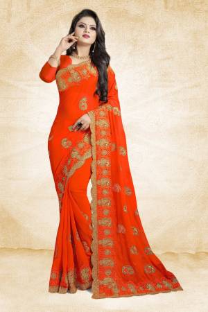 This Festive Season, Grab This Designer Saree In Orange Color Paired With Orange Colored Blouse. This Saree And Blouse Are Georgette Based Beautified With heavy Attractive Embroidery. 