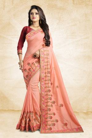 Look Pretty In This Lovely Designer Saree In Peach Color Paired With Maroon Colored Blouse. This Pretty Embroidered Saree In Fabricated On Satin Silk Paired With Art Silk Fabricated Blouse. It Has Contrasting Colored Embroidery Giving The Saree An Attractive Look.