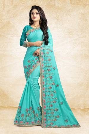 Look Pretty In This Lovely Designer Saree In Blue Color Paired With Blue Colored Blouse. This Pretty Embroidered Saree In Fabricated On Satin Silk Paired With Art Silk Fabricated Blouse. It Has Contrasting Colored Embroidery Giving The Saree An Attractive Look.