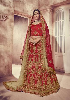 Here Is A Perfect Bridal Look For You With This Heavy designer Lehenga Choli In Red Color. This Lehenga Choli Is Silk Based Paired With Net Fabricated Dupatta Two Dupattas, One In Red And Another In Beige Color. Its Fabric Also Ensures Superb Comfort Throughout The Gala. 
