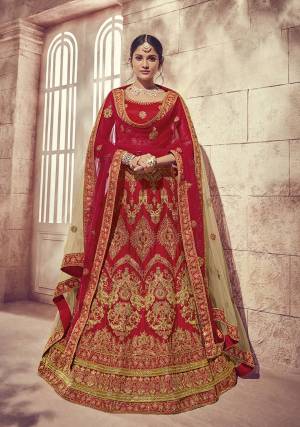 Get Ready For Your Big Day With This Heavy Designer Lehenga Choli In Red Color. This Heavy Embroidered Lehenga Choli Is Fabricated On Art Silk Paired With Net Fabricated Two Dupattas, One In Red And Another In Beige Color. It Is Beautified With Heavy Jari Embroidery and Stone Work. Buy Now