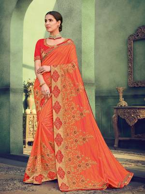 All the Fashionable women will surely like to step out in style wearing this orange color two tone silk saree. this gorgeous saree featuring a beautiful mix of designs. look gorgeous at an upcoming any occasion wearing the saree. Its attractive color and designer heavy embroidered saree, Flower patch design, stone design, beautiful floral design work over the attire & contrast hemline adds to the look. Comes along with a contrast unstitched blouse.