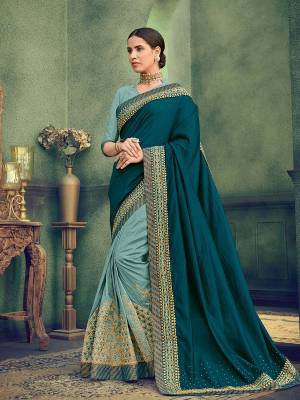 Flaunt a new ethnic look wearing this Teal And Steel Blue color two tone silk and two tone silk fabrics saree. this party wear saree won't fail to impress everyone around you. this gorgeous saree featuring a beautiful mix of designs. Its attractive color and designer heavy embroidered saree, stone design, beautiful floral design work over the attire & contrast hemline adds to the look. Comes along with a contrast unstitched blouse.