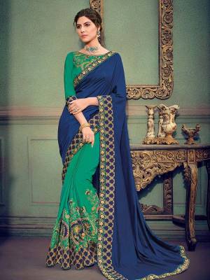 you Look striking and stunning after wearing this Royal Blue and green color two tone silk and two tone silk fabrics saree. look gorgeous at an upcoming any occasion wearing the saree. this party wear saree won't fail to impress everyone around you. Its attractive color and designer heavy embroidered saree, stone design, beautiful floral design work over the attire & contrast hemline adds to the look. Comes along with a contrast unstitched blouse.
