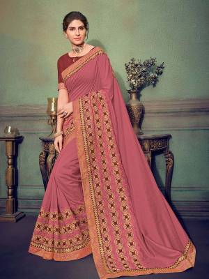 Flaunt a new ethnic look wearing this Pink color silk fabrics saree. Ideal for party, festive & social gatherings. this gorgeous saree featuring a beautiful mix of designs. Its attractive color and designer heavy embroidered saree, stone design, beautiful floral design work over the attire & contrast hemline adds to the look. Comes along with a contrast unstitched blouse.