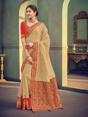 The fabulous pattern makes this beige color shimmer georgette saree. Ideal for party, festive & social gatherings. this gorgeous saree featuring a beautiful mix of designs. Its attractive color and designer heavy embroidered saree, stone design, beautiful floral design work over the attire & contrast hemline adds to the look. Comes along with a contrast unstitched blouse.
