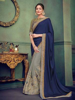 Presenting this Navy Blue and grey color silk fabrics and georgette saree. Ideal for party, festive & social gatherings. this gorgeous saree featuring a beautiful mix of designs. Its attractive color and designer heavy embroidered saree, stone design, beautiful floral design work over the attire & contrast hemline adds to the look. Comes along with a contrast unstitched blouse.