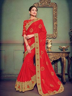 Show your elegance by wearing this gorgeous red color silk fabrics saree. Ideal for party, festive & social gatherings. this gorgeous saree featuring a beautiful mix of designs. Its attractive color and designer heavy embroidered saree, stone design, beautiful floral design work over the attire & contrast hemline adds to the look. Comes along with a contrast unstitched blouse.