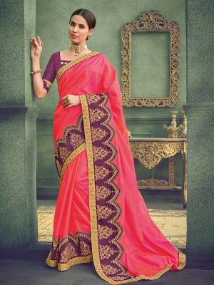 Attractively Gorgeous mesmerizing is what you will look at the next wedding gala wearing this beautiful pink color two tone silk saree. Ideal for party, festive & social gatherings. this gorgeous saree featuring a beautiful mix of designs. Its attractive color and designer heavy embroidered saree, stone design, beautiful floral design work over the attire & contrast hemline adds to the look. Comes along with a contrast unstitched blouse.