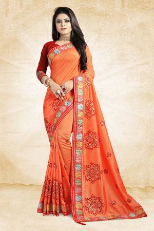 Go Colorful This Festive Season Wearing This Designer Saree In Orange Color Paired With Contrasting Red Colored Blouse. This Saree And Blouse Are Silk Based Beautified With Contrasting Work Over It. Buy This Designer Saree Now.