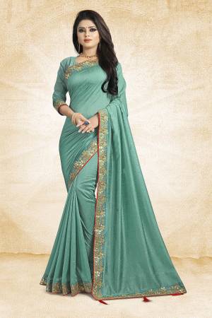 Flaunt Your Rich And Elegant Taste Weairng This Designer Silk Based Saree In Aqua Blue Color Paired With Aqua Blue Colored Blouse. It Is Beautified With Attractive Embroidered Lace Border.