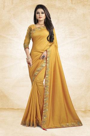 Flaunt Your Rich And Elegant Taste Weairng This Designer Silk Based Saree In Musturd Yellow Color Paired With Musturd Yellow Colored Blouse. It Is Beautified With Attractive Embroidered Lace Border.