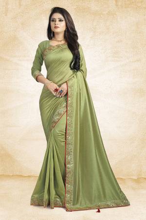 Flaunt Your Rich And Elegant Taste Weairng This Designer Silk Based Saree In Light Green Color Paired With Light Green Colored Blouse. It Is Beautified With Attractive Embroidered Lace Border.
