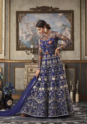 Shine Bright Wearing This Heavy Designer Floor Length Suit In Royal Blue Color Paired With Royal Blue Colored Bottom And Dupatta. Its Top And Dupatta Are Net Fabricated Paired With Art Silk Bottom And Inner. Its top Is Beautified With Heavy Contrasting Work All Over. 