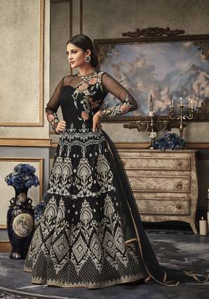 For A Bold, Beautiful And Heavy Look, Grab This Heavy Designer Floor Length Suit In Black Color Paired With Black Colored Bottom And Dupatta. Its Heavy Embroidered Top Is Fabricated On Net Paired With Silk Based Bottom And Net Fabricated Dupatta. Buy This Now.
