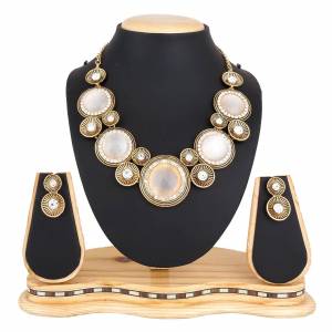 For A Girly Elegant Look, Grab This Beautiful Designer Necklace Set In Pretty Gold Color. This Necklace Set Is Beautified With Diamond Work. Also This Can Be Paired With Colored Indo-Western Or Ethnic Attire. Buy Now.