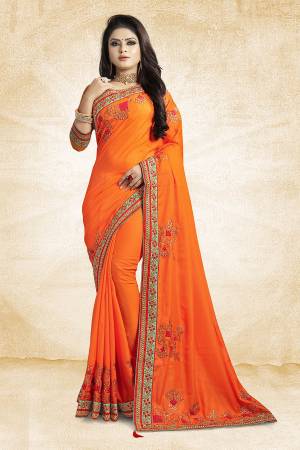 Get Ready For The Upcoming Festive And Season With This Designer Saree In Orange Color Paired With Orange Colored Blouse. This Saree Is Fabricated On Satin Silk Paired With Art Silk Fabricated Blouse. It Is Beautified With Attractive Embroidery Over The Saree.