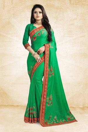 Get Ready For The Upcoming Festive And Season With This Designer Saree In Green Color Paired With Green Colored Blouse. This Saree Is Fabricated On Satin Silk Paired With Art Silk Fabricated Blouse. It Is Beautified With Attractive Embroidery Over The Saree.