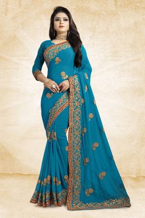 Add This Beautiful Designer Saree To Your Wardrobe In Blue Color Paired With Blue Colored Blouse. This Pretty Embroidered Saree Is Georgette Based Paired With Art Silk Fabricated Blouse. It Is Light Weight and Easy To Drape. Buy Now.