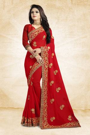 Add This Beautiful Designer Saree To Your Wardrobe In Red Color Paired With Red Colored Blouse. This Pretty Embroidered Saree Is Georgette Based Paired With Art Silk Fabricated Blouse. It Is Light Weight and Easy To Drape. Buy Now.