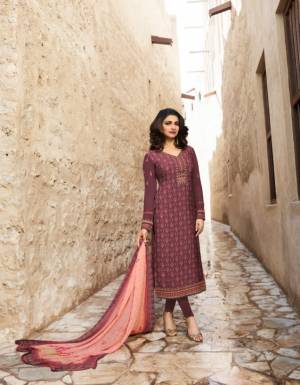 A Must Have Shade In Every Womens Wardrobe Is Here With This Designer Straight Suit In Wine Color Paired With Contrasting Peach Colored Dupatta. Its Top And bottom Are Fabricated on Crepe Paired With Chiffon Fabricated Dupatta. Buy This Suit Now.