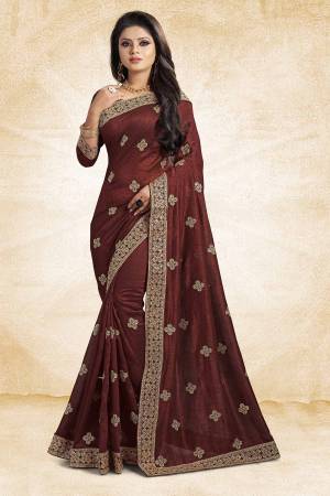 For Rich, Heavy And Elegant Look, This Saree Is Suitable For All.?Grab This Designer Saree In Brown Color Paired With Brown Colored Blouse. This Saree And Blouse Are Silk Based Beautified With Embroidered Buttis And Lace Border. Buy Now
