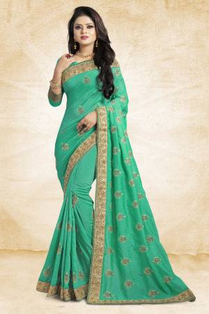 For Rich, Heavy And Elegant Look, This Saree Is Suitable For All.?Grab This Designer Saree In Sea Green Color Paired With Sea Green Colored Blouse. This Saree And Blouse Are Silk Based Beautified With Embroidered Buttis And Lace Border. Buy Now