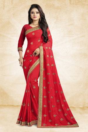 Look Pretty In This Lovely Designer Saree In Red Color Paired With Red Colored Blouse. This Pretty Embroidered Saree In Fabricated On Vichitra Silk Paired With Art Silk Fabricated Blouse. It Has Jari Embroidery With Stone Work Giving The Saree An Attractive Look.