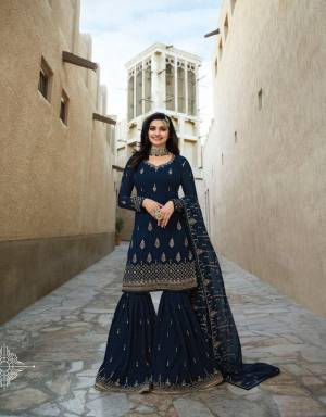 Here Is A Very Pretty Designer Sharara Suit In Navy Blue Color Paired With Navy Blue Colored Bottom And Dupatta. Its Top And Bottom Are Fabricated On Georgette paired With Chiffon Fabricated Dupatta. Buy Now.
