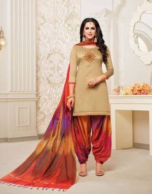 Stylist in every sense, this Beige colored patiala suit with beautiful  handwork. Crafted from soft silk with banarasi dupatta fabric, it is light in weight and will be soft against your skin, this suit set will go well with sandal sand look fashionable.