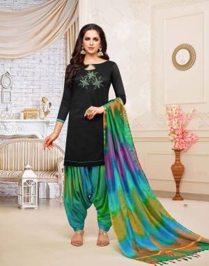 Rich And Elegant Looking Patiala Suit In Black Colored Top Paired With Multi Colored Bottom And Dupatta. This Dress Material Is Fabricated On Soft Silk Beautified With Hand Work Over The Top. Buy Now.