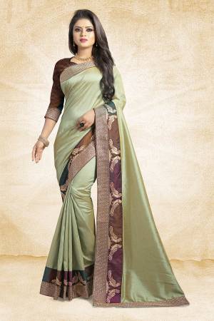 Rich And Elegant Looking Designer Silk Based Saree Is Here In Pastel Green Color Paired With Brown Colored Blouse. This Saree And Blouse are Fabricated On Art Silk Beautified With Emroidered Lace. Buy Now.