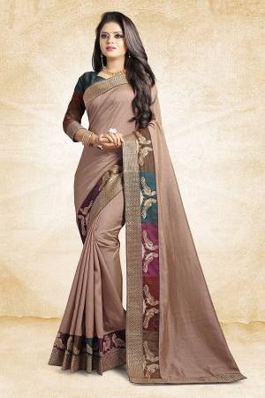 Rich And Elegant Looking Designer Silk Based Saree Is Here In Mauve Color Paired With Brown Colored Blouse. This Saree And Blouse are Fabricated On Art Silk Beautified With Emroidered Lace. Buy Now.