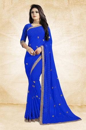 This Festive Season, Look Elegant With This Light Weight Saree In Royal Blue Color Paired With Royal Blue Colored Blouse. This Saree Is Fabricated On Georgette Paired With Art Silk Fabricated Blouse. It Is Beautified With Embroidered Butti And Lace Border. 