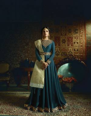 New Shade In Blue Is Here To Add Into Your Wardrobe With This Designer Floor Length Suit In Teal Blue Color Paired With Contrasting Pastel Green Colored Dupatta. Its Top Is Fabricated On Satin Georgette Paired With Santoon Bottom And Banarasi Jacquard Silk Dupatta. Buy This New Color Pallete Now.