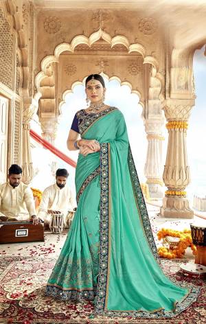 Grab This Beautiful Designer Saree In Sea Green Color Paired With Contrasting Navy Blue Colored Blouse. This Saree Is Fabricated On Soft Silk Paired With Art Silk Fabricated Blouse. It Is Easy To Drape And Durable. 