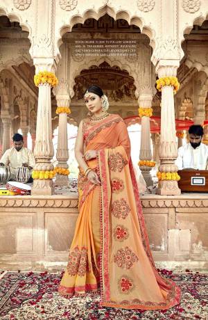 Simple And Elegant Looking Designer Saree Is Here In Pretty Peach And Orange Color Paired With Orange Colored Blouse. This Saree Is Fabricated On Satin Silk Paired With Art Silk Fabricated Blouse. It Has Pretty Contrasting Embroidery giving It An Attractive Look .