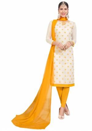 Rich And Elegant looking Dress Material Is Here In Chanderi Silk Fabricated Top Paired With Cotton Bottom And Chiffon Dupatta. Get This Stitched As Per Your Desired Fit And Comfort. Its Rich Color Pallete Of White And Yellow Will Also Earn You Lots Of Compliments From Onlookers. 