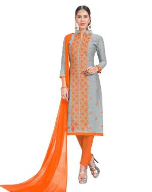 Add This Pretty Dress Material To Your Wardrobe And Get This Stitched As Per Your Desired Comfort. Its Top IS Grey Color Paired With Contrasting Orange Colored Bottom And Dupatta. Buy This Now.