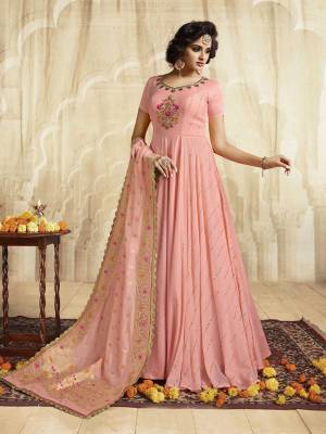 Look Pretty In This Designer Floor Length Gown In Pink Color Paired With Pink Colored Dupatta. Its Top Is Fabricated On Silk And Georgette Paired With Jacquard Silk Fabricated Dupatta. This Readymade Gown Is Available In Regular Sizes, Choose As Per Your Desired Fit And Comfort. 