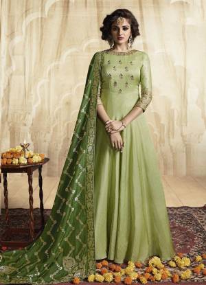 Pretty Shades In Green Are Here With This Designer Floor Length Readymade Gown In Light Green Color Paired With Green Colored Dupatta. Its Top Is Fabricated On Rich Satin Linen Paired With Jacquard Silk Fabricated Dupatta. Buy this Gown Now.